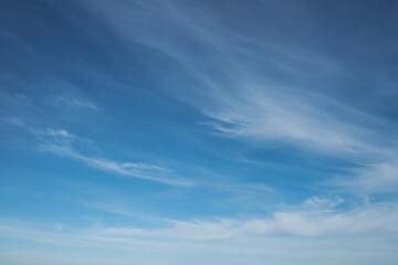 Naklejka na ściany i meble Beautiful blue sky with clouds background.