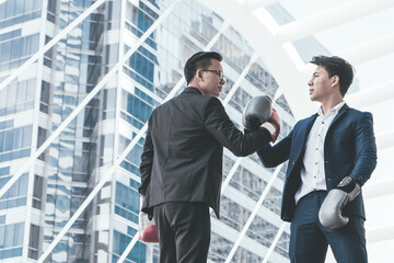 Young asian business people fighting for successful of his business.Business fighting concept.