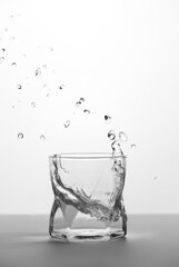 Glass with water with splash