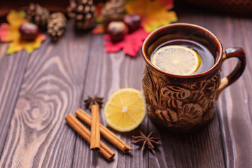 Fototapeta na wymiar Autumn fall flat lay, top view. Autumn leaves, a mug of tea. on a rustic wooden background