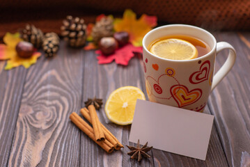 Autumn fall flat lay, top view. Autumn leaves, a mug of tea. on a rustic wooden background