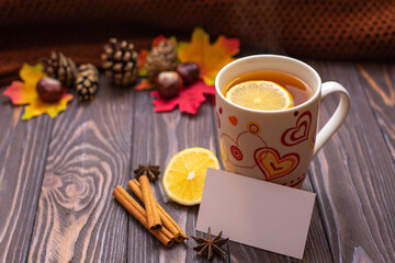 Autumn fall flat lay, top view. Autumn leaves, a mug of tea. on a rustic wooden background