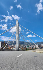 Medellin, Antioquia, Colombia. June 5, 2020: South avenue bridge and mountains and blue sky.