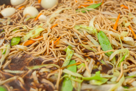 Closeup of Pancit Cabagan, a dish originating from Isabela, Philippines. Miki noodles soaked in sauce.