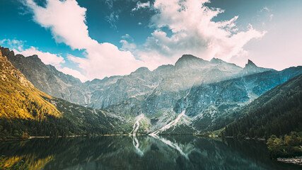 Tatra National Park, Poland. Famous Mountains Lake Morskie Oko Or Sea Eye Lake In Summer Evening. Beautiful Sunset Sunrays Above Tatras Lake Landscape © Great Brut Here
