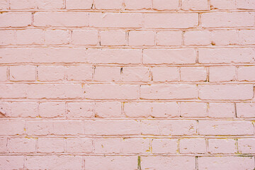 Pastel pink brick wall background, copy space