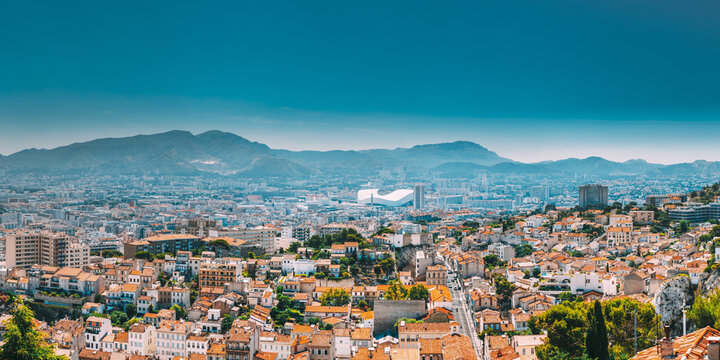 Urban Panorama, Aerial View, Cityscape Of Marseille, France. Sunny Summer Day With Bright Blue Sky. Cityscape Of Marseille, France. Urban Background With Sport Velodrome Stadium. Stade Velodrome