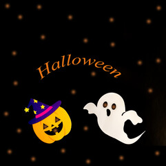 White ghost and yellow pumpkin in a purple hat with stars on a black background with orange text Halloween. Copy space. View from above. Minimal.