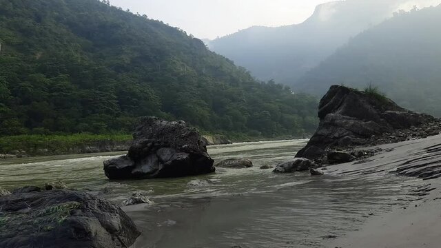Morning view at GOA beach located in Rishikesh Uttarakhand near Laxman Jhula, Clean view of Ganga river at Rishikesh during early morning time, World famous GANGA river full view