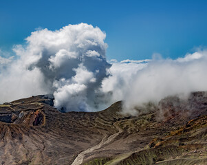 Heavy smoke bursting out from active volcano crater of Aso in Kyushu, Japan