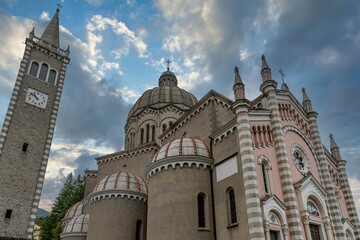 Fototapeta na wymiar Parish Church of San Mamante, Lizzano in Belvedere, Italy, under a dramatic sky