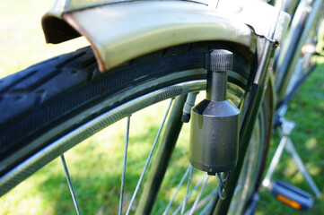 Closeup shot of a bicycle dynamo - obrazy, fototapety, plakaty