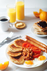 Traditional British breakfast with sausages and beans