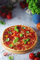Pizza with salami and basil
