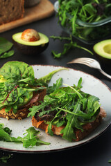 Sandwiches with salmon, avocado and salad	