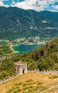 Beautiful alpine summer view with the Ossiach lake at the famous Landskron castle ruins, Villach, Kaernten, Austria