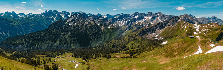 Fototapeta na wymiar High resolution stitched panorama of a beautiful alpine summer view with the Kleinwalsertal in the background seen from the famous Fellhorn summit near Oberstdorf, Bavaria, Germany