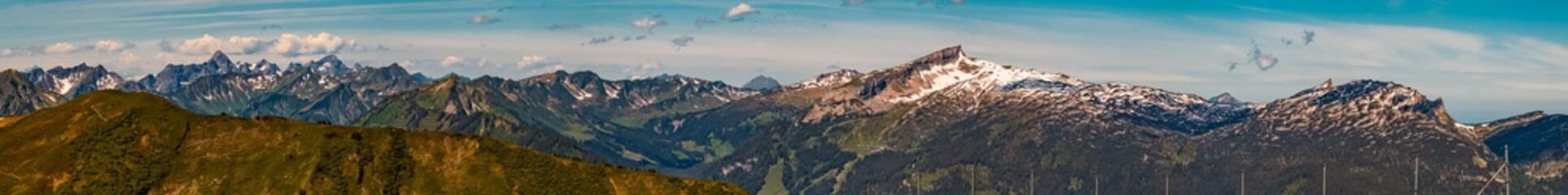 High resolution stitched panorama of a beautiful alpine summer view with the Kleinwalsertal in the background seen from the famous Fellhorn summit near Oberstdorf, Bavaria, Germany