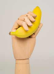 Hand holding a banana. Concept for male masturbation. Male penis erection. Penis size concept