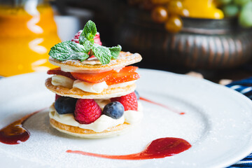 Traditional sweet pastry with three layers of airy dough with whipped cream