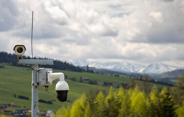 CCTV camera on the mountains. Big brother is watching you. Invigilation. Surveillance.
