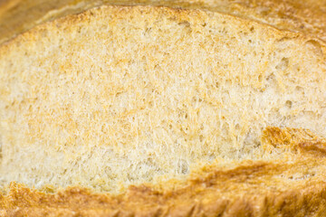 Roasted Bread texture background. Loaf Bakery concept. Close up, macro photo. Beautiful natural wallpaper.
