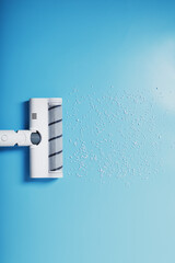 The nozzle of the turbo brush of a modern vacuum cleaner on a blue background cleans garbage.