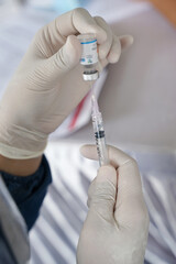 Doctor holding a syringe with liquid sinovac vaccines Concept fight against virus covid19