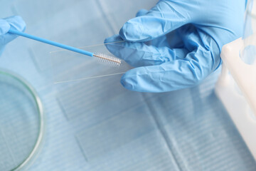 Taking vaginal smear from women on glass closeup