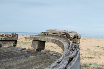 Close up of wooden bow of abandoned fishing boat wreck at Dungeness, Kent, England