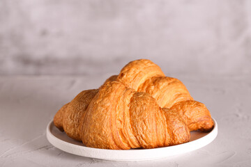 a fresh croissant with chocolate is on the table