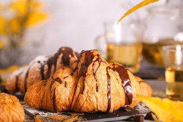 a fresh croissant with chocolate is on the table
