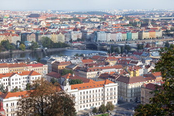 Prague panoramic beautiful panoramic aerial view above of the rooftops. Prague cityscape skyline view at river Vltava and rooftop buildings in Czech Republic.