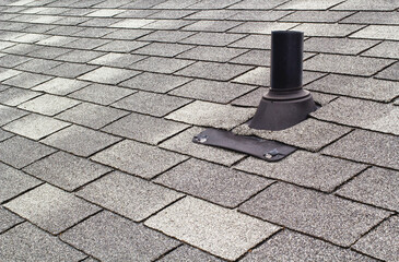 Rooftop shingles and vent pipe