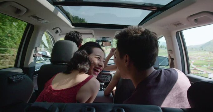 Happy young friends enjoying road trip,4K