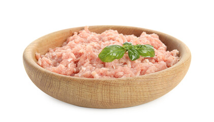 Raw chicken minced meat with basil in bowl on white background