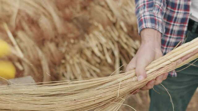 Farmer Making Traditional Straw Broom with sorghum, natural broom
