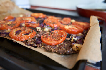 Healthy pizza with a pad made of flaxseed