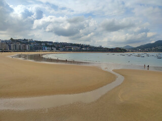 La Concha beach after the low tide of the Atlantic Ocean, San Sebastian, Donostia, Spain