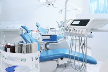 Dentist's office interior with chair and modern equipment