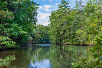 Fototapeta na wymiar Mirror water Souhegan River near Wildcat Falls, Merrimack, New Hampshire, USA 
