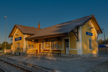 Fototapeta na wymiar Zbytiny station with blue sky and sunrise light in Sumava autumn mountains