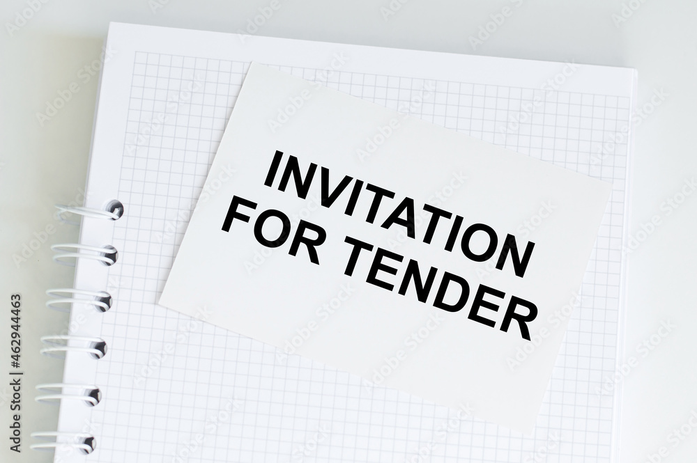 Poster notepad with a card with text invitation for tender.