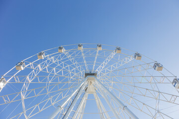 a Ferris wheel against the blue sky