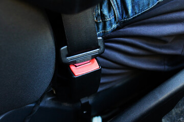 Fastened seat belt in the car closeup