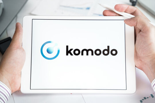 Moscow Russia 20.07.2021 Logo of Komodo coin in mobile phone. Cryptocurrency KMD token. Trading blockchain platform to buy,sell on decentralized exchange DEX. Digital money.Business,investing