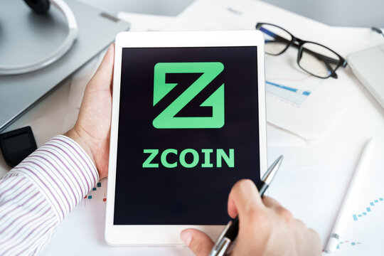 Moscow Russia 20.07.2021 Logo of Zcoin coin in mobile phone. Cryptocurrency XZC, Firo token. Trading blockchain platform to buy,sell on decentralized exchange DEX. Digital money.Business,investing