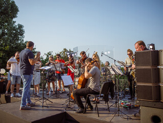 Musical ensemble playing classic instrumental music outdoors