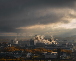 Low clouds over an industrial area in an early autumn morning 