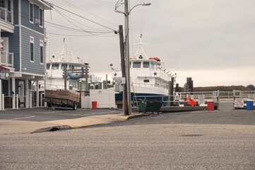 Two Large Boats at Docks in Sunlight